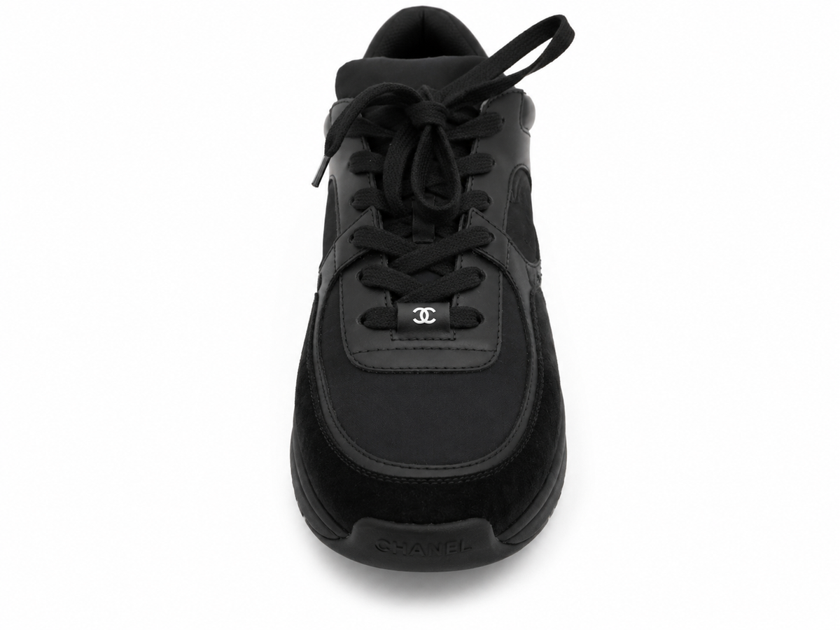Baskets Chanel Runner en cuir et daim noir