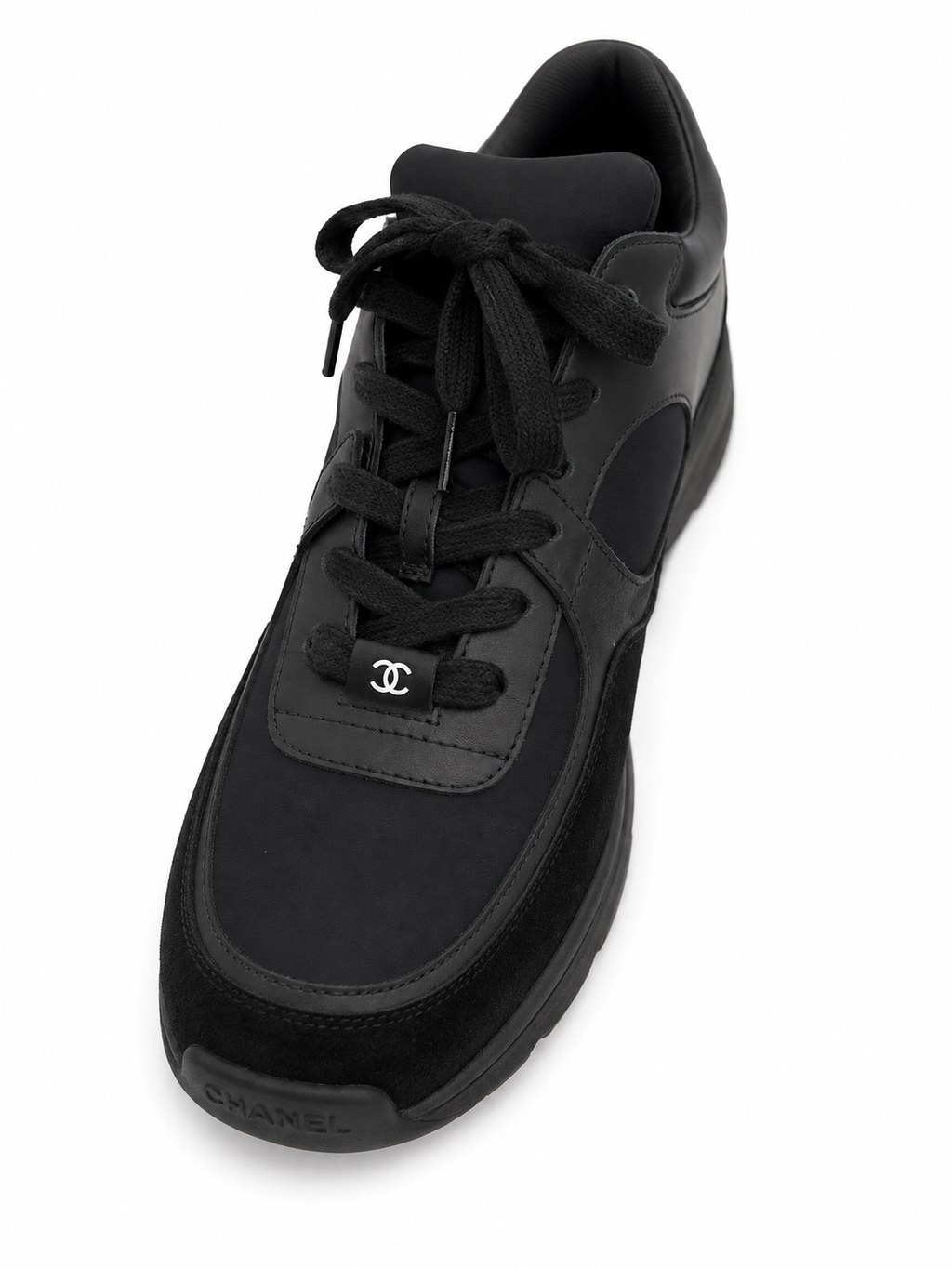 Baskets Chanel Runner en cuir et daim noir