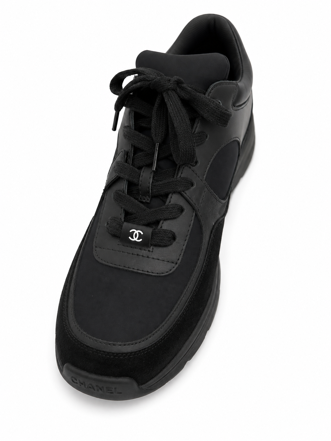 Baskets Chanel Runner en cuir et daim noir