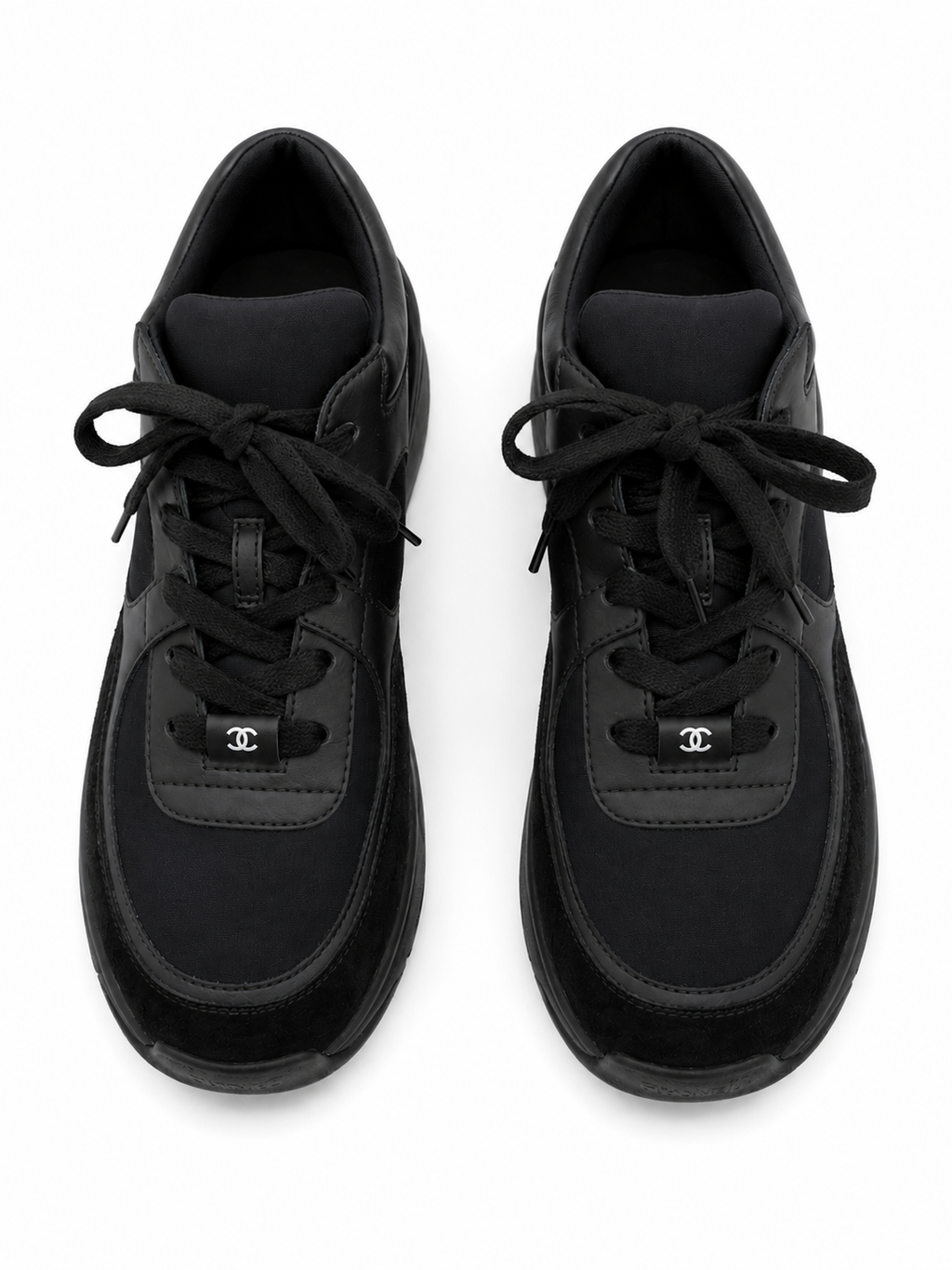 Baskets Chanel Runner en cuir et daim noir