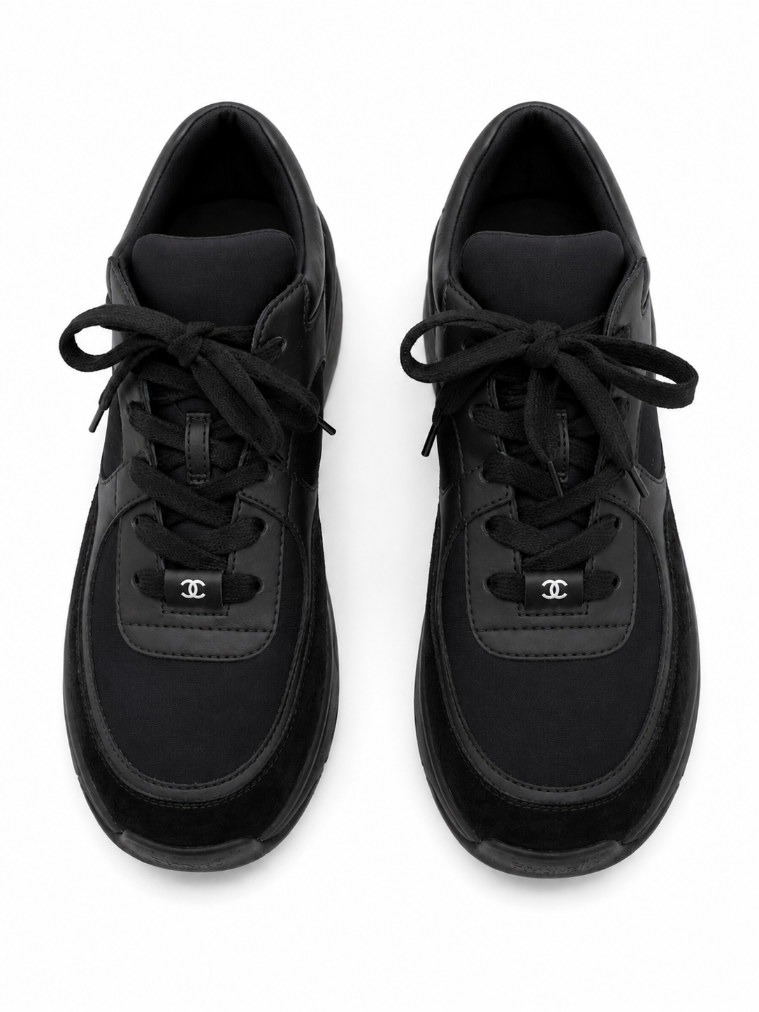 Baskets Chanel Runner en cuir et daim noir
